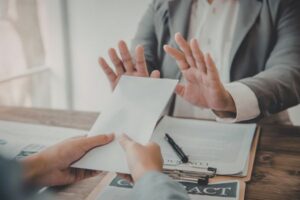 man declining the paper contract