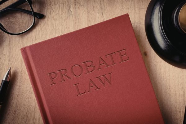 PROBATE LAW BOOK WITH A GAVEL AND PEN BESIDE