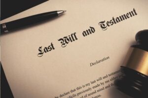 last will and testament document with gavel and pen