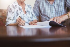 old couple Reviewing Beneficiary Designations